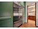 Gourmet kitchen featuring stainless steel refrigerator, hardwood floors, and custom cabinets at 3488 Tuxedo Nw Rd, Atlanta, GA 30305
