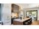 Elegant kitchen with marble counters, premium appliances, hood, and an open view to living space at 3488 Tuxedo Nw Rd, Atlanta, GA 30305