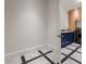 View of a stylish laundry room with blue cabinets, stone countertops, and unique patterned flooring at 3488 Tuxedo Nw Rd, Atlanta, GA 30305