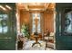 Cozy library with wood paneling, built-in shelving, and a fireplace at 3488 Tuxedo Nw Rd, Atlanta, GA 30305