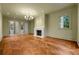 Living room showcasing herringbone floors, fireplace, and neutral wall color with recessed lighting at 3488 Tuxedo Nw Rd, Atlanta, GA 30305