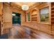 Elegant living room features wood paneling, built-in bookshelves, hardwood floors, and an accent room at 3488 Tuxedo Nw Rd, Atlanta, GA 30305
