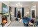 Elegant living room with fireplace, Christmas tree and chandelier at 3488 Tuxedo Nw Rd, Atlanta, GA 30305
