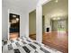 Open living space with herringbone wood floors, natural light, and open access to another room at 3488 Tuxedo Nw Rd, Atlanta, GA 30305