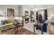 Bright living room with fireplace, chandelier, and hardwood floors at 3488 Tuxedo Nw Rd, Atlanta, GA 30305