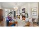 Cozy living room featuring a fireplace, herringbone floors, and ample seating at 3488 Tuxedo Nw Rd, Atlanta, GA 30305
