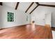 Bright living room features vaulted ceilings, wood beams, and hardwood flooring at 3488 Tuxedo Nw Rd, Atlanta, GA 30305