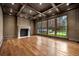 Spacious living room with fireplace, coffered ceiling, and large windows with natural light at 3488 Tuxedo Nw Rd, Atlanta, GA 30305