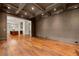 Open-concept living area with coffered ceiling, hardwood floors, and seamless transition to the kitchen at 3488 Tuxedo Nw Rd, Atlanta, GA 30305