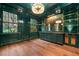 Elegant living room with a stylish wet bar, hardwood floors and bright windows at 3488 Tuxedo Nw Rd, Atlanta, GA 30305