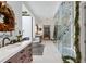 This gorgeous main bathroom features marble counters, tile flooring and a glass shower at 3488 Tuxedo Nw Rd, Atlanta, GA 30305
