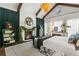 This main bedroom is bright with exposed wood beams and a cozy fireplace at 3488 Tuxedo Nw Rd, Atlanta, GA 30305