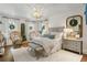 Elegantly furnished primary bedroom features designer lighting, cozy seating, and refined decor at 3488 Tuxedo Nw Rd, Atlanta, GA 30305