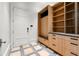 Mudroom with custom built-ins, bench seating, and durable tile flooring at 3488 Tuxedo Nw Rd, Atlanta, GA 30305