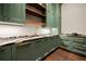 Butler's pantry with green cabinets, open shelving, custom counters, and stylish hardware at 3488 Tuxedo Nw Rd, Atlanta, GA 30305