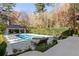 Beautiful pool area with lounge chairs, spa, and well-maintained landscaping at 3488 Tuxedo Nw Rd, Atlanta, GA 30305