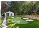 Private putting green with sand traps offers a fun recreational area for golf enthusiasts at 3488 Tuxedo Nw Rd, Atlanta, GA 30305