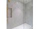 Marble shower with modern fixtures and glass enclosure at 3488 Tuxedo Nw Rd, Atlanta, GA 30305