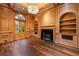 Elegant study featuring wood paneling, built-in bookshelves, and a fireplace at 3488 Tuxedo Nw Rd, Atlanta, GA 30305