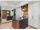 A walk-in closet with a center island, custom storage and mirrored door at 3488 Tuxedo Nw Rd, Atlanta, GA 30305