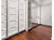 Bright walk-in closet with mirrored doors and custom shelving at 3488 Tuxedo Nw Rd, Atlanta, GA 30305