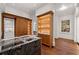 Open and spacious walk-in closet with built-in storage, center island, and natural light from the window at 3488 Tuxedo Nw Rd, Atlanta, GA 30305