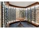 Elegant wine cellar featuring custom stone walls, herringbone floors, and stylish bottle racks at 3488 Tuxedo Nw Rd, Atlanta, GA 30305