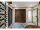 Stone wine cellar featuring custom wine racks and a stone tile floor at 3488 Tuxedo Nw Rd, Atlanta, GA 30305