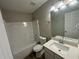 Clean bathroom, featuring a bathtub, toilet, and vanity with a white countertop at 7069 Ravenwood Ln, Lithonia, GA 30038