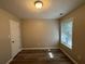 Simple bedroom with hardwood floors and a window at 7069 Ravenwood Ln, Lithonia, GA 30038