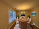 Bright dining room featuring a wood table and chandelier at 7069 Ravenwood Ln, Lithonia, GA 30038
