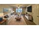 Spacious living room with hardwood floors, neutral walls, and ample natural light at 7069 Ravenwood Ln, Lithonia, GA 30038