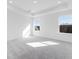 Bright main bedroom features neutral walls, carpet, and abundant natural light at 3267 Durston Ct, Dacula, GA 30019