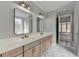 Bright bathroom featuring a double vanity and large mirrors at 3609 Centerville Rosebud Rd, Snellville, GA 30039