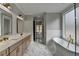 Spa-like bathroom with freestanding soaking tub and double vanity at 3609 Centerville Rosebud Rd, Snellville, GA 30039