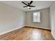 Bright bedroom with hardwood floors and a ceiling fan at 3609 Centerville Rosebud Rd, Snellville, GA 30039