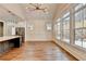 Bright dining area with hardwood floors and wall of windows at 3609 Centerville Rosebud Rd, Snellville, GA 30039