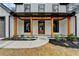 Inviting front porch with wooden posts and a charming entryway at 3609 Centerville Rosebud Rd, Snellville, GA 30039