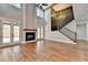 Two-story great room with hardwood floors, a fireplace, and a staircase at 3609 Centerville Rosebud Rd, Snellville, GA 30039