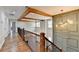 Stunning upper hallway with hardwood floors and an open railing at 3609 Centerville Rosebud Rd, Snellville, GA 30039