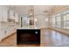 Modern kitchen with large island, white quartz countertops and dark cabinetry at 3609 Centerville Rosebud Rd, Snellville, GA 30039