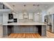 Stunning kitchen island with white quartz countertop and dark cabinetry at 3609 Centerville Rosebud Rd, Snellville, GA 30039