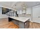 Open kitchen with large island, white cabinets and gold fixtures at 3609 Centerville Rosebud Rd, Snellville, GA 30039
