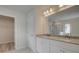Modern bathroom featuring double vanity with stone countertop and a large walk-in shower at 16 Camellia Dr, Fairburn, GA 30213