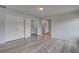 Spacious bedroom with modern flooring and closet leading to laundry area at 16 Camellia Dr, Fairburn, GA 30213