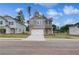 Charming two-story home with a brick and siding facade and a two-car garage at 16 Camellia Dr, Fairburn, GA 30213