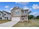 Attractive two-story home featuring a brick and siding exterior with a two-car garage at 16 Camellia Dr, Fairburn, GA 30213