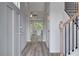 Inviting foyer with wood-look floors, a staircase, and views into the open-concept living spaces at 16 Camellia Dr, Fairburn, GA 30213