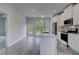 Stylish kitchen with white cabinets, stainless steel appliances, and an island with a sink at 16 Camellia Dr, Fairburn, GA 30213