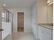 Modern main bathroom features a tile shower and double vanity at 16 Camellia Dr, Fairburn, GA 30213